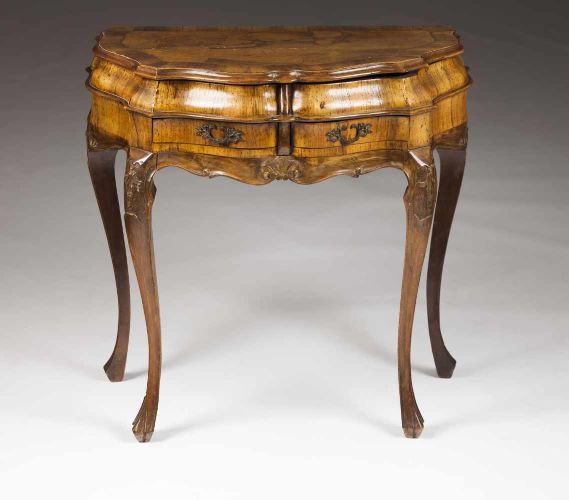 A small side tableWalnutWalnut marquetry and carved decorationTwo drawers and till-top<