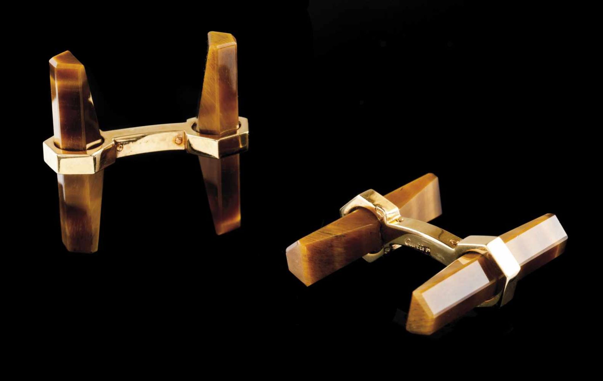 A pair of Cartier cufflinksGoldFaceted tiger's eye cross bars French assay marks 750/10