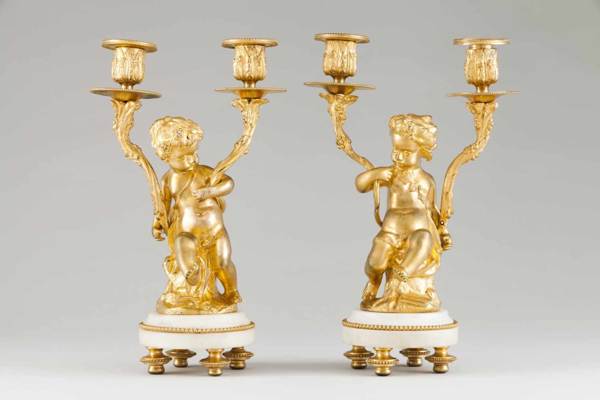 A pair of two branch candelabraGilt bronze and marblePutti shafts19th century(small
