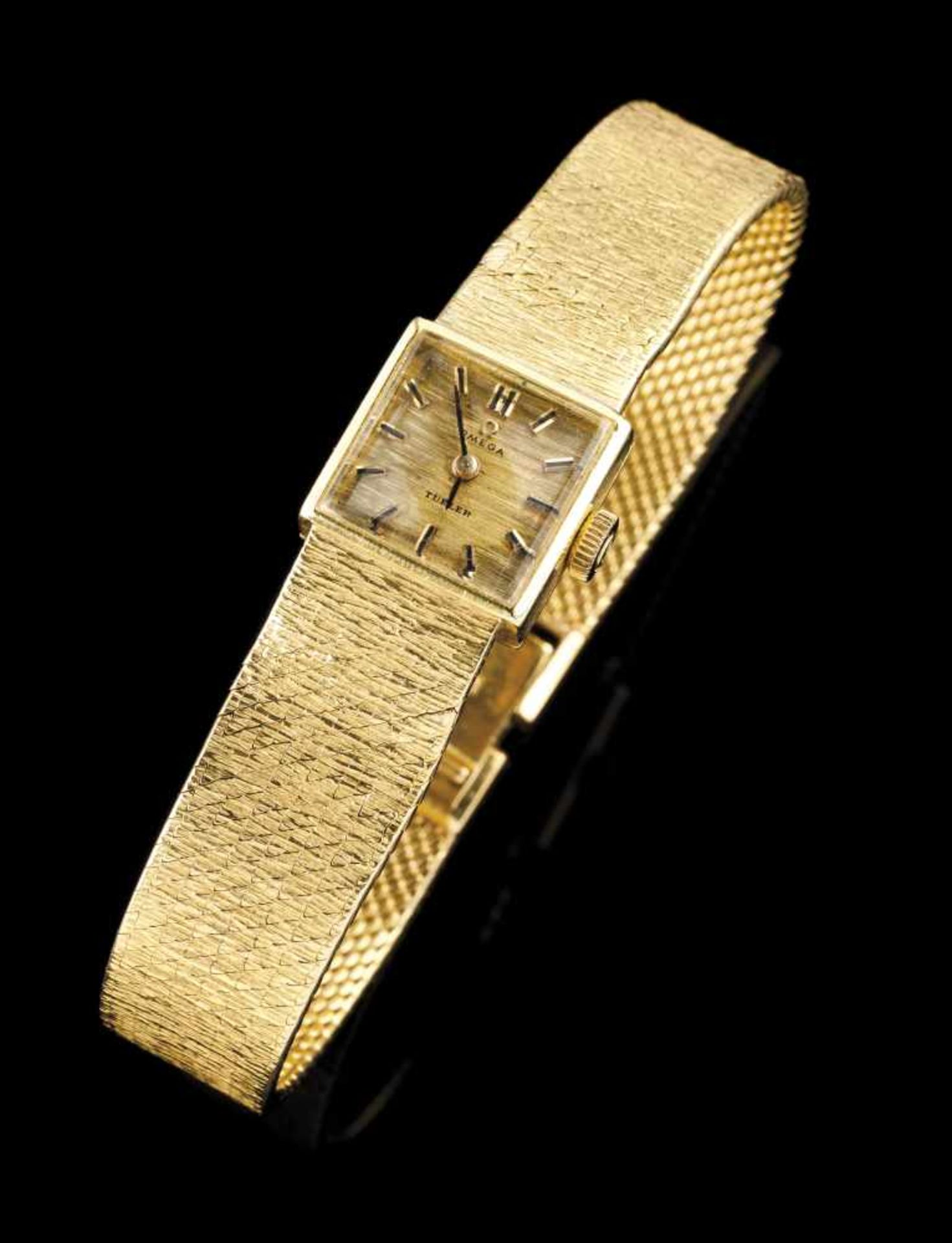 An Omega watchGoldTurner ladies model of mechanic movementSquare face and textured stra