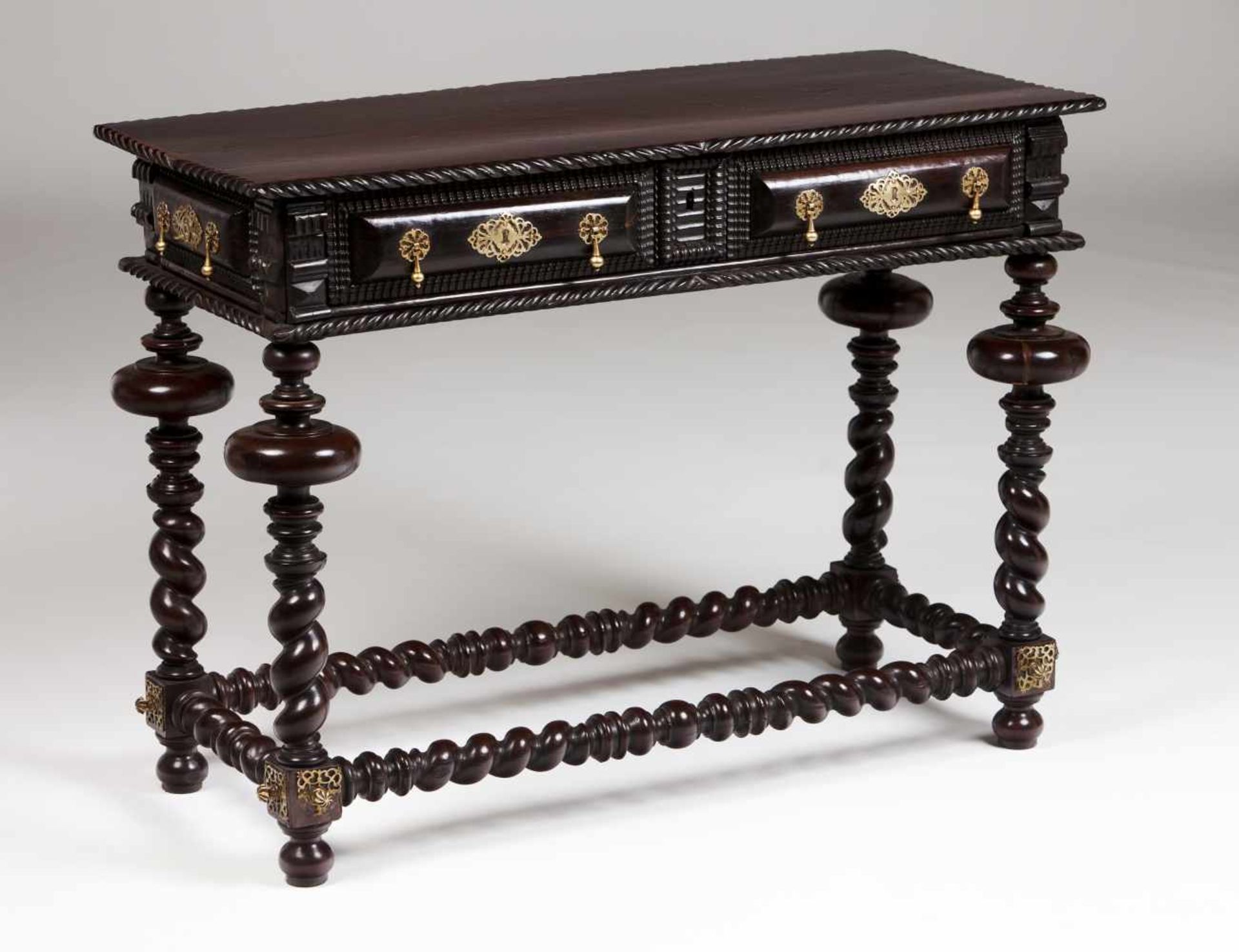 A "bufete" tableVeneered in rosewood and other timbersTwo drawers simulating sixCarved