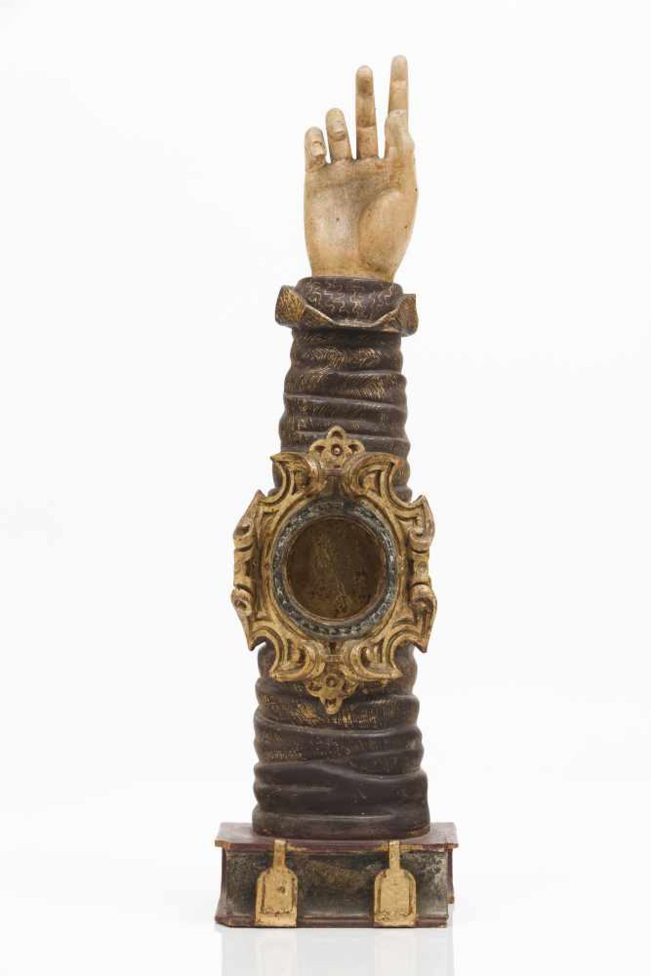 An arm reliquaryCarved and polychrome woodBaroque cartouche shaped frame to relic compartme