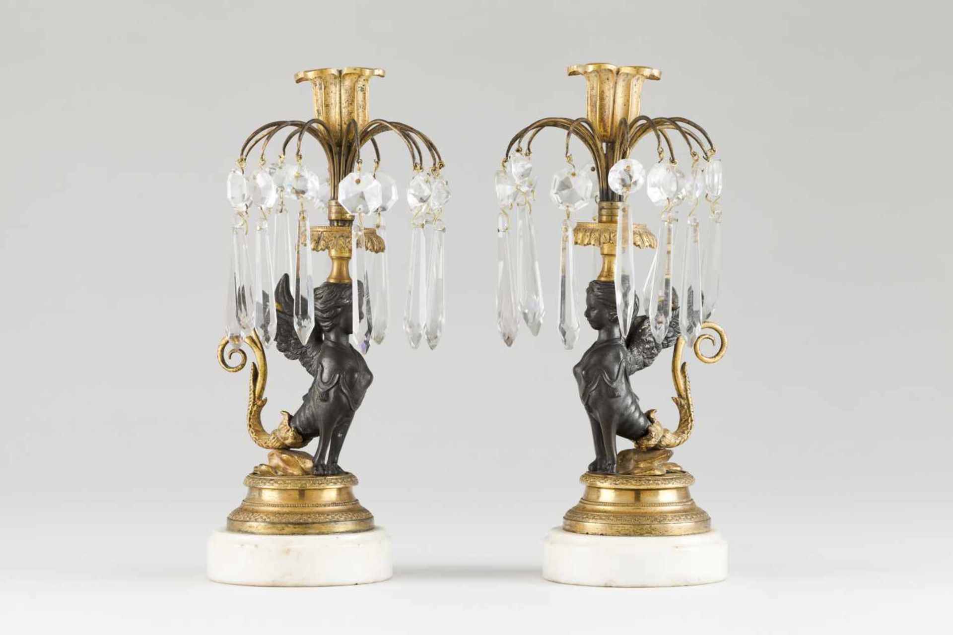 A pair of Regency candle standsGilt and patinated bronzePart engraved decoration of foliage