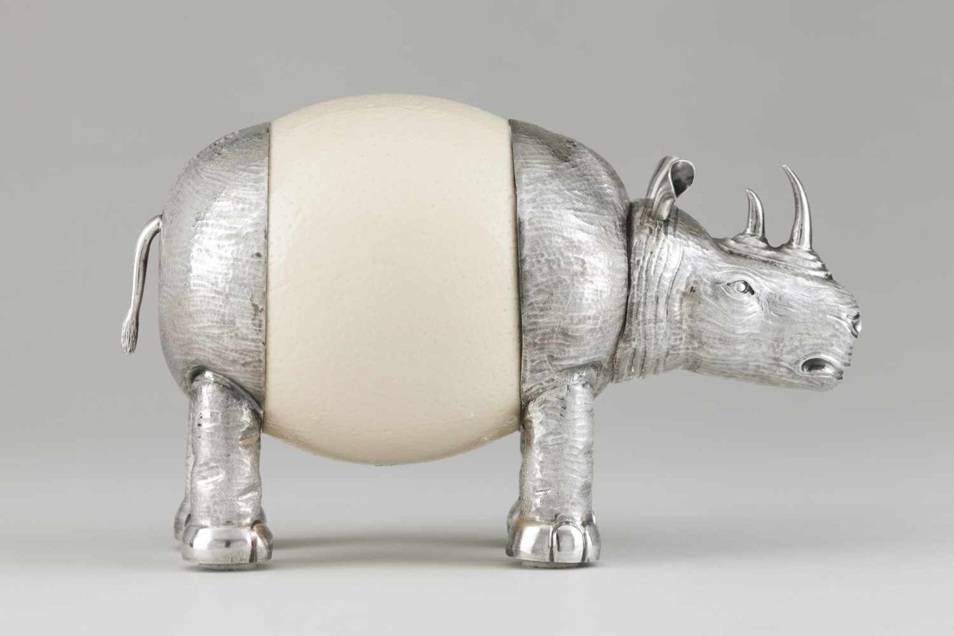 A rhinocerosCarved and chiselled silver and ostrich eggLisbon hallmark, Eagle 925/000 (post