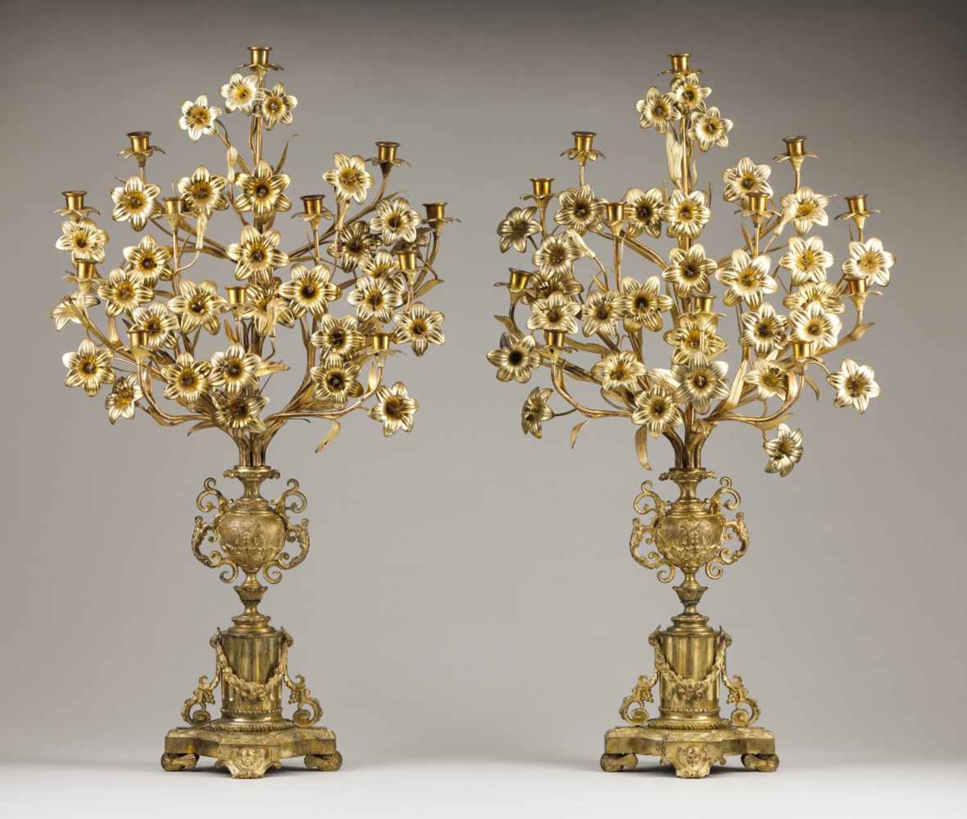 A pair of palms/twelve branch candelabraGilt bronzeUrns on neoclassical plinth shafts and f