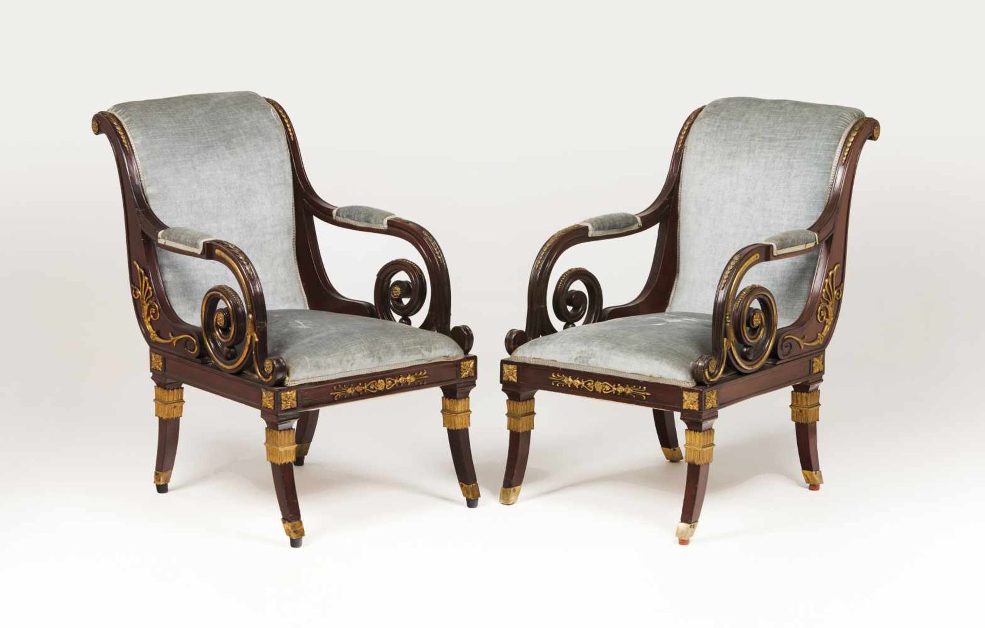 A pair of Empire style armchairsMahoganyApplied yellow metal elementsTextile upholstere