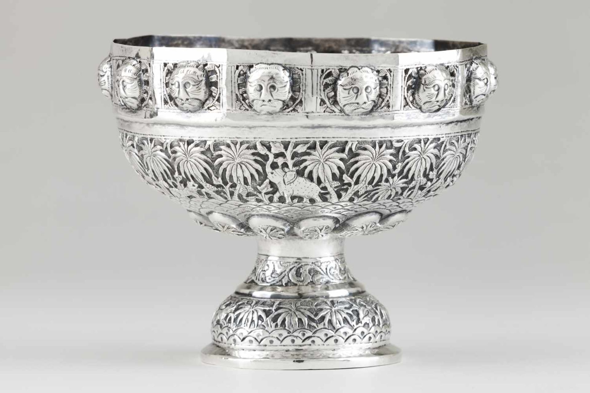 A BowlIndian silverprofusely decorated in relief, pierced and chiselled, with orientalist m