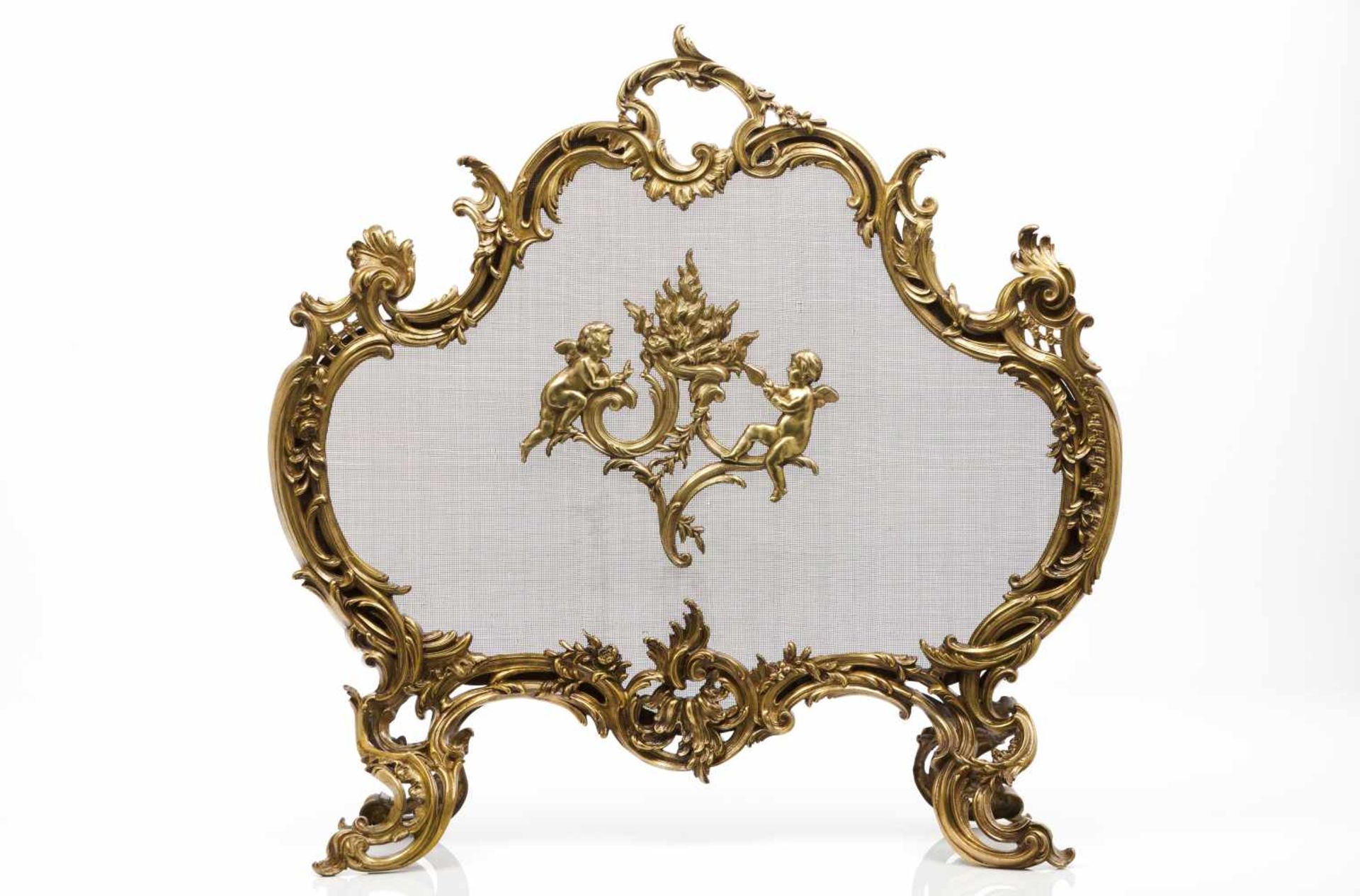 A louis XV style fireplace, Charles CasierGilt bronzeCentral putti decorationMarked <br
