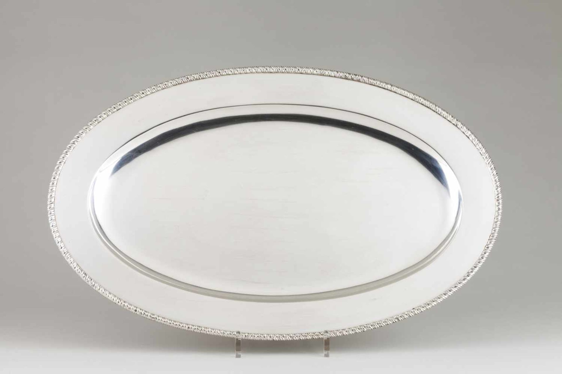 An oval serving dishPortuguese silverPlain base of gadrooned friezeLisbon hallmark, Eag