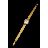 A BreitlingGoldLady's wrist watch of rectangular case and bevel set with 38 8/8 cut diamondsWhite