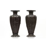 A pair of vasesPatinated bronzeBaluster shaped, scalloped and of raised decoration depicting