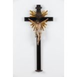 A crucified ChristPolychrome wooden sculptureRosewood cross of carved and gilt terminalsUnmarked