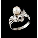 A "toi-et-moi" ringGoldSet with one cultured pearl (7mm)and a brilliant cut diamond (ca.0.12ct)
