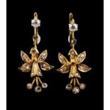 A pair of drop earringsPortuguese goldArticulated flower set with two antique cut diamonds totalling