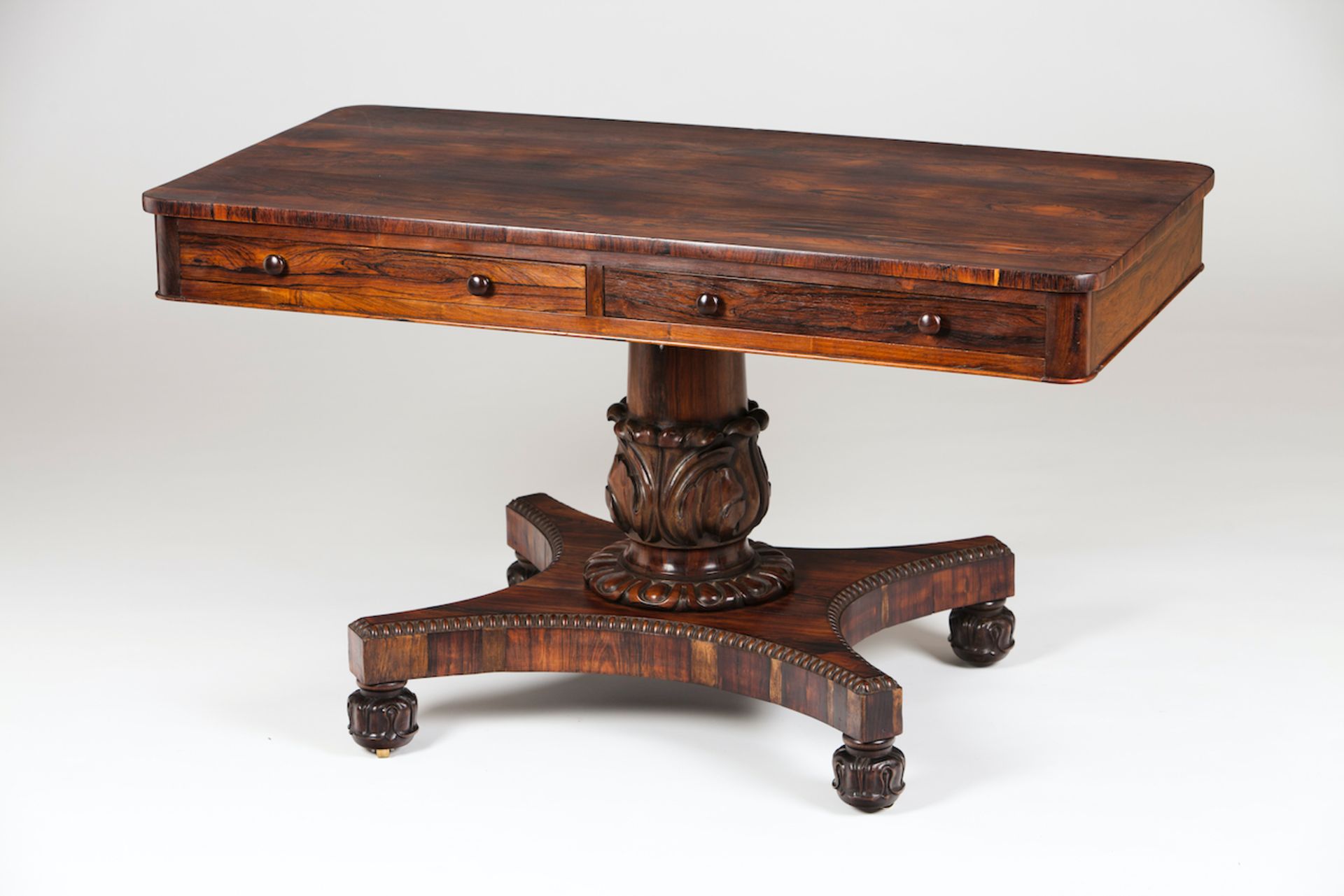 A William IV sofa-tableRosewood and rosewood veneerTwo drawers simulating fourCarved foliage