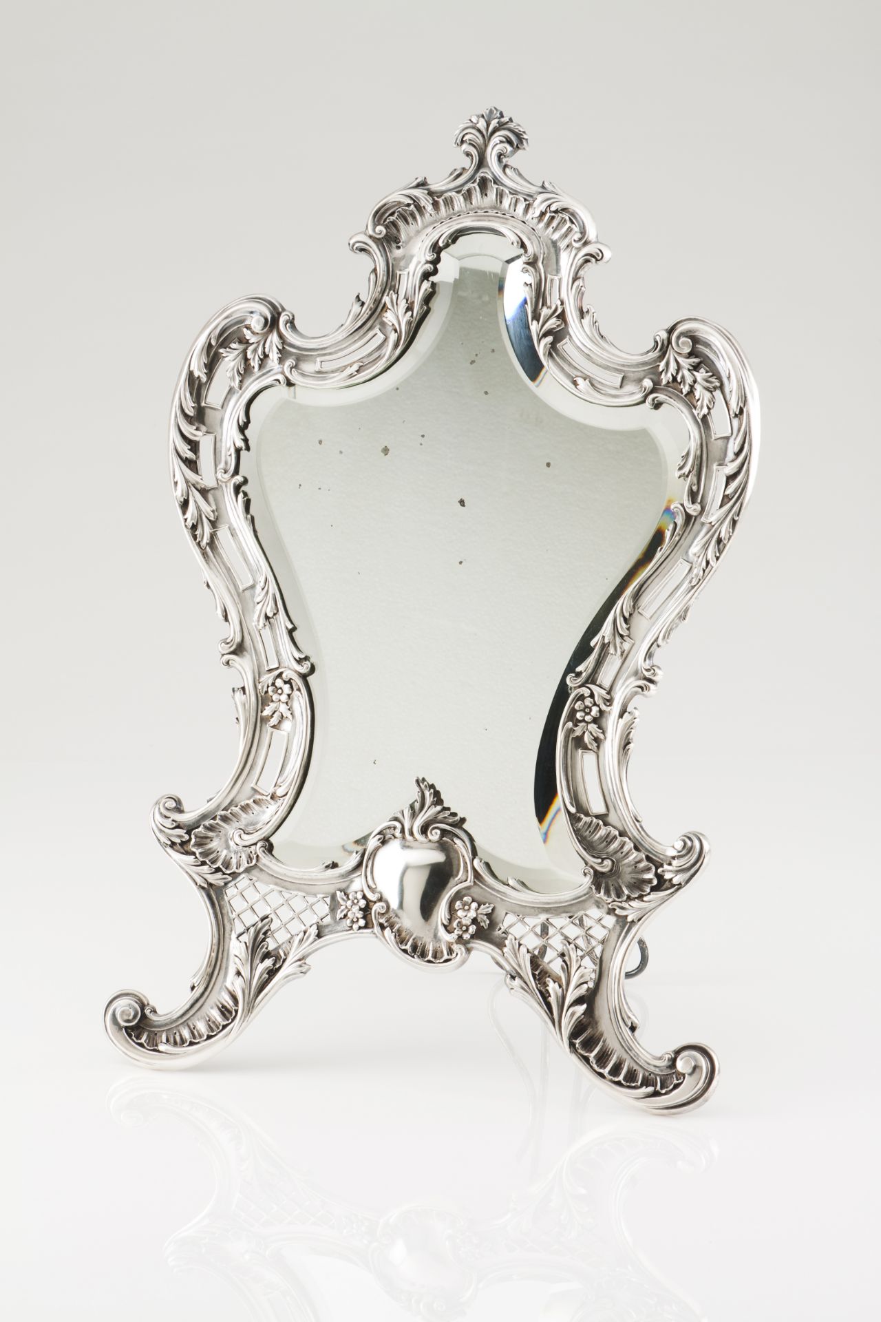 A table mirrorPortuguese silverRomantic period decoration of pierced and raised floral and foliage