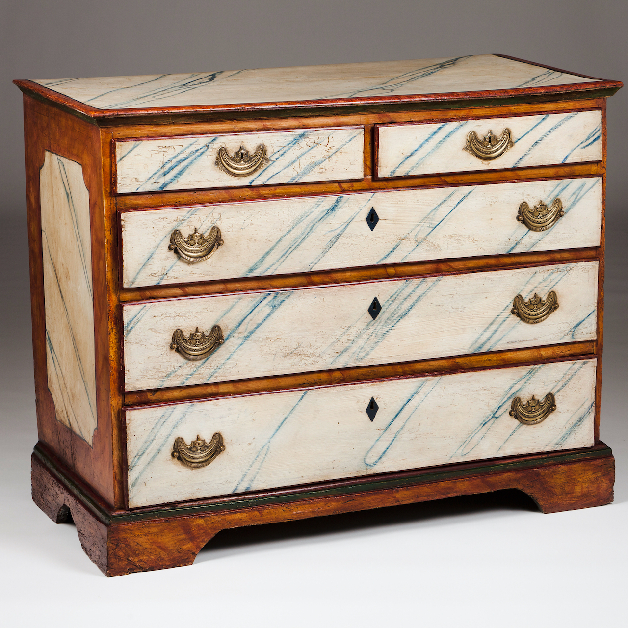 A D.Maria chest of drawersPainted and marbled woodTwo short and two long drawersYellow metal