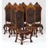 A set of six tall backed João V style dining chairsChestnutScalloped aprons and carved