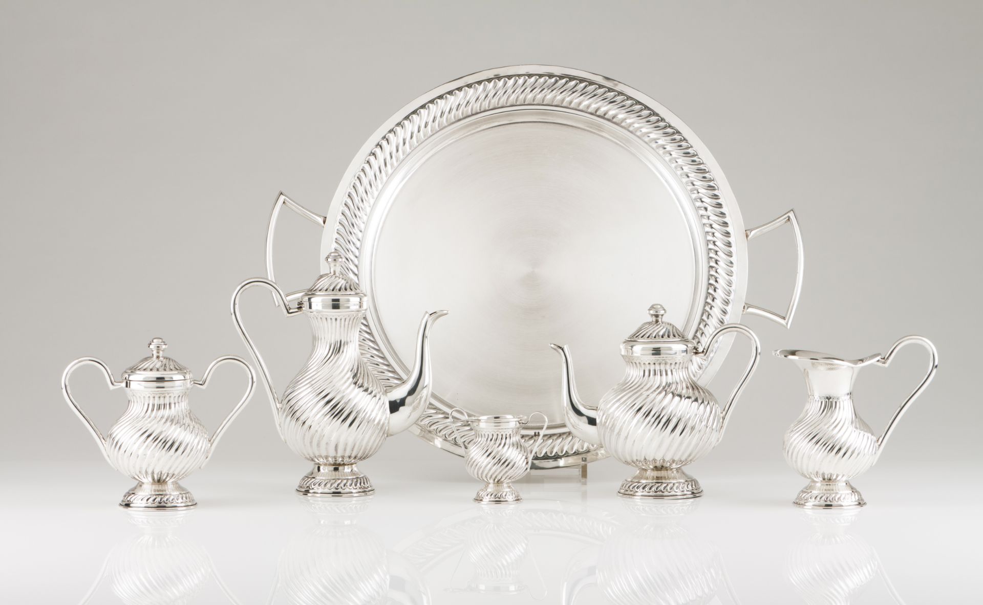 A tea and coffee set with trayPortuguese silverSpiralled fluting decoration to body and cover with