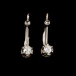 A pair of drop earringsBicoloured goldSet with two antique brilliant cut diamonds totalling (ca.0.