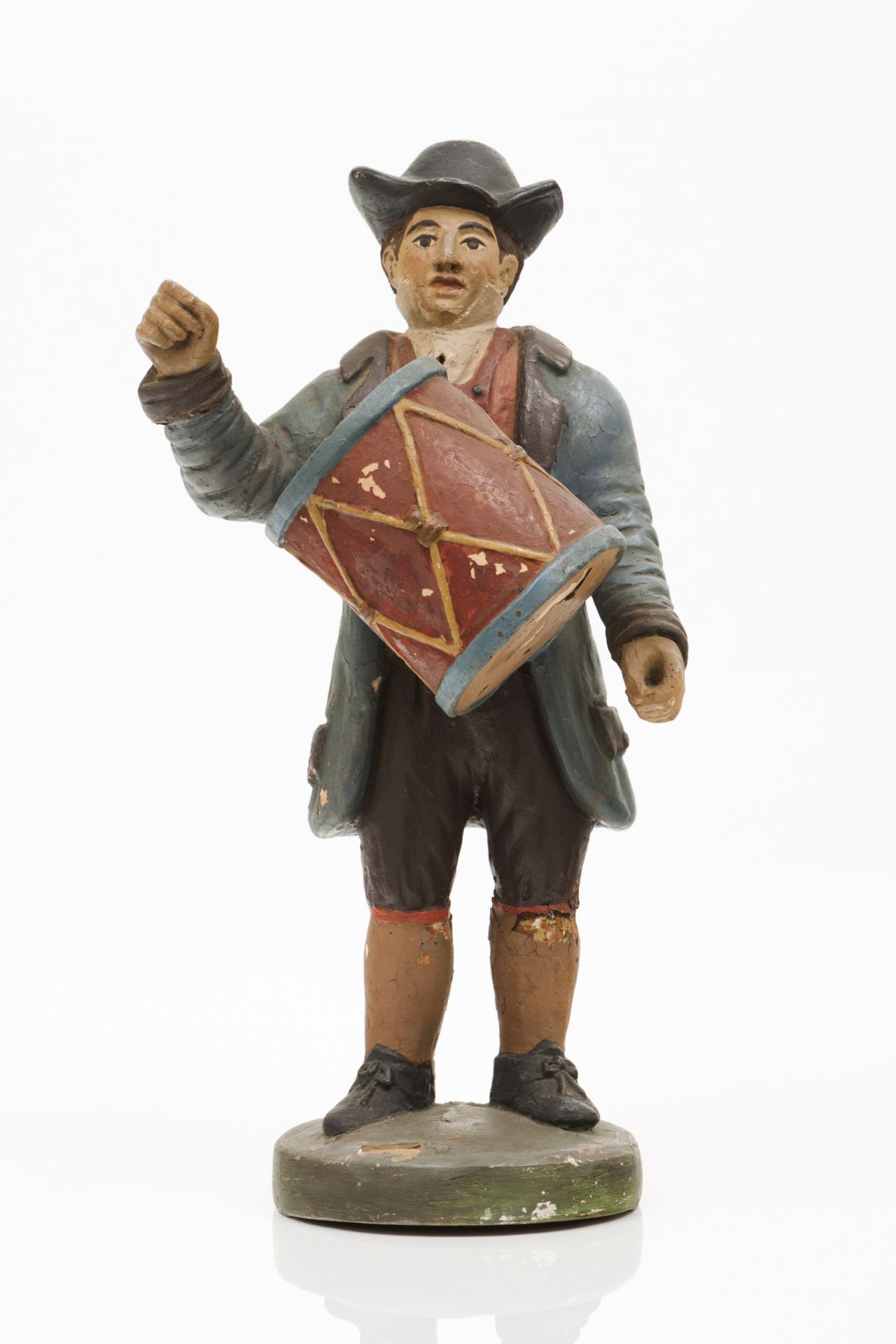 A musician with drumPolychrome terracottaPortugal, 19th century(losses and faults)Height: 33,5 cm