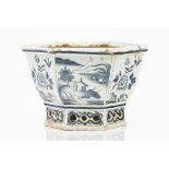 A faience flower bowlDelft faienceBlue and white decoration of flowers, insects and river views with