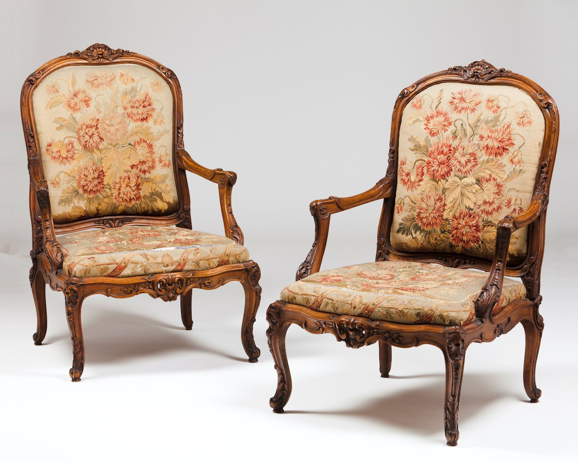 A pair of Louis XV style fauteuilsWalnutOf carved decorationTapestry upholsteryFrance, 19th century