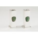 A pair of candle sticksPlain silverStraight lines with applied jadeite carved lion's headOporto