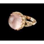 A ringGoldCabochon cut scalloped crib set pink quartz of 13mm diameter set with small 8/8 cut