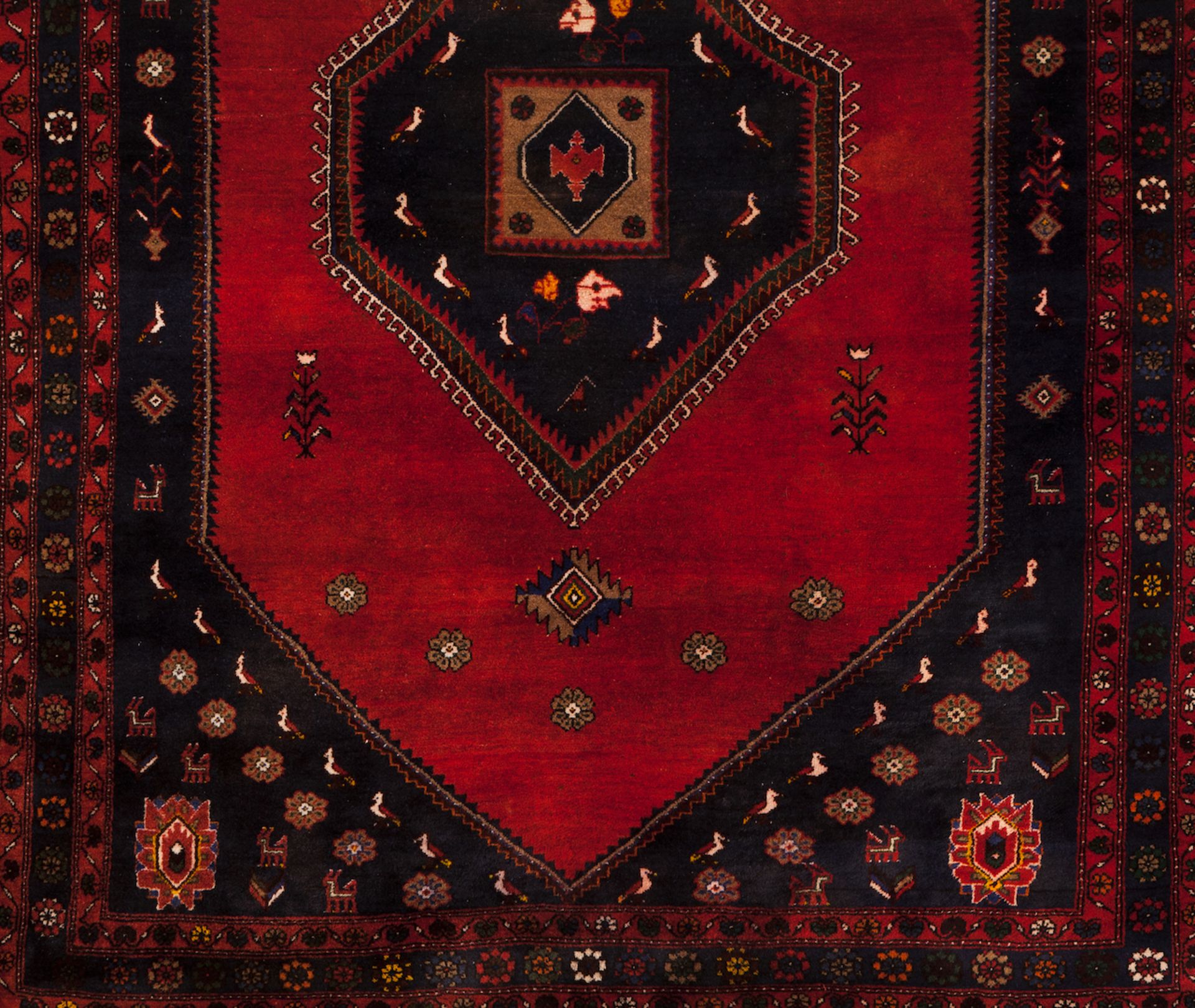 A Kelardasht rug, IranWool and cotton of geometric and floral design in blue, bordeaux and beige