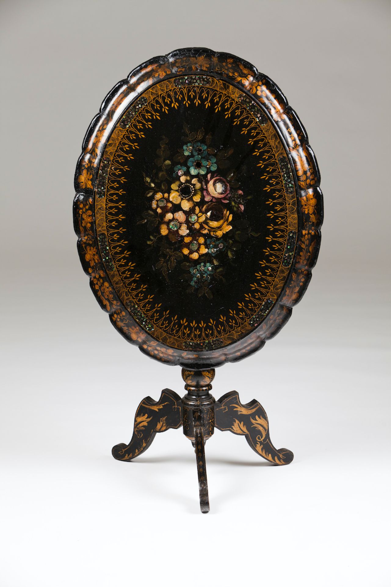 A Victorian tripod tableScalloped papier-mâché tilting top of floral mother-of-pearl inlay and