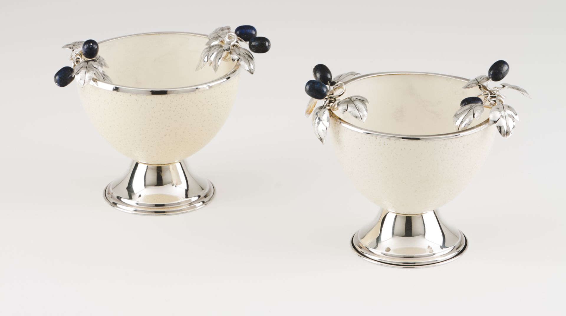 A pair of bowlsSilver and ostrich eggApplied with Lapis-lazuli foliage and fruitsOn a turned