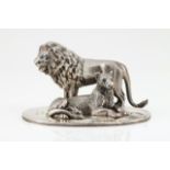 A pair of lionsPortuguese silverSculpture depicting a Kizigo (Tanzania) lion and lioness on an