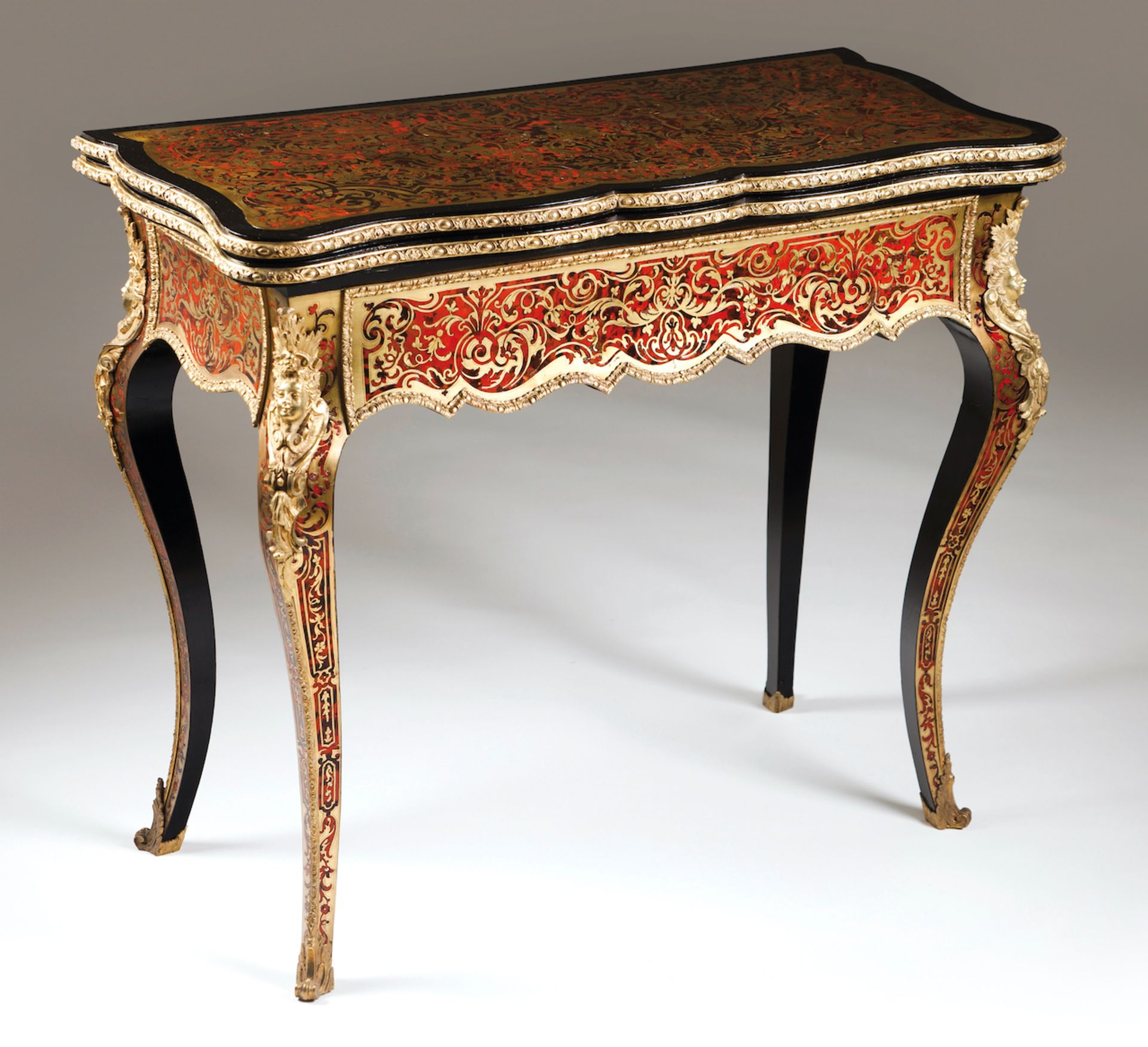 A Boulle style card tableDarkened woodBrass and tortoiseshell marquetry decorationGilt bronze