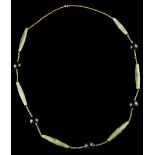 A necklaceGold meshWith applied jade and hardstone sphere elementsEurope, ca. 1960Unmarked, in