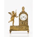 A table clockGilt bronzeDecoration of Cupid holding cornucopia, female bust and low-relief with