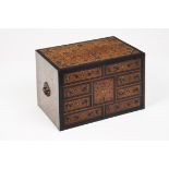 A small Indo-Portuguese cabinetTeakEbony, teak and ebony inlaid decoration of floral motifs and