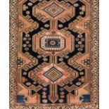 A Malayer rug, IranWool and cotton of floral and geometric pattern in blue, salmon and beige