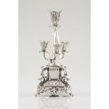 An unusual toothpick holderPortuguese silver, 19th centuryFour tulip pleated cone shaft on a