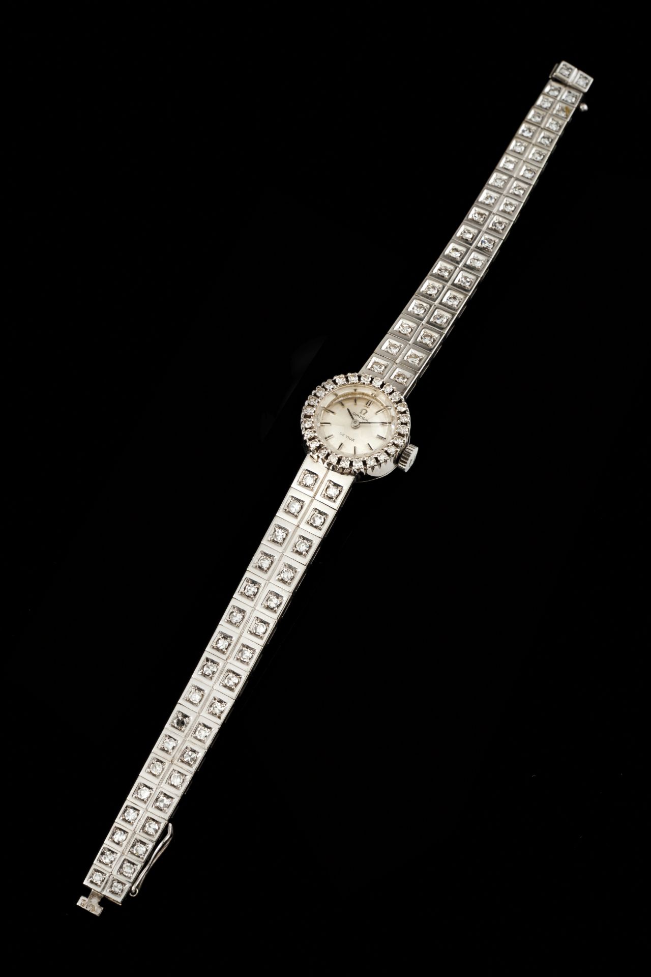 An Omega de villeGoldLady's wrist watch of white face with batons, bevel and strap set with 70 8/8