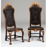 A pair of tall back D. João V chairsPart carved and gilt walnutEngraved leather seats and backs