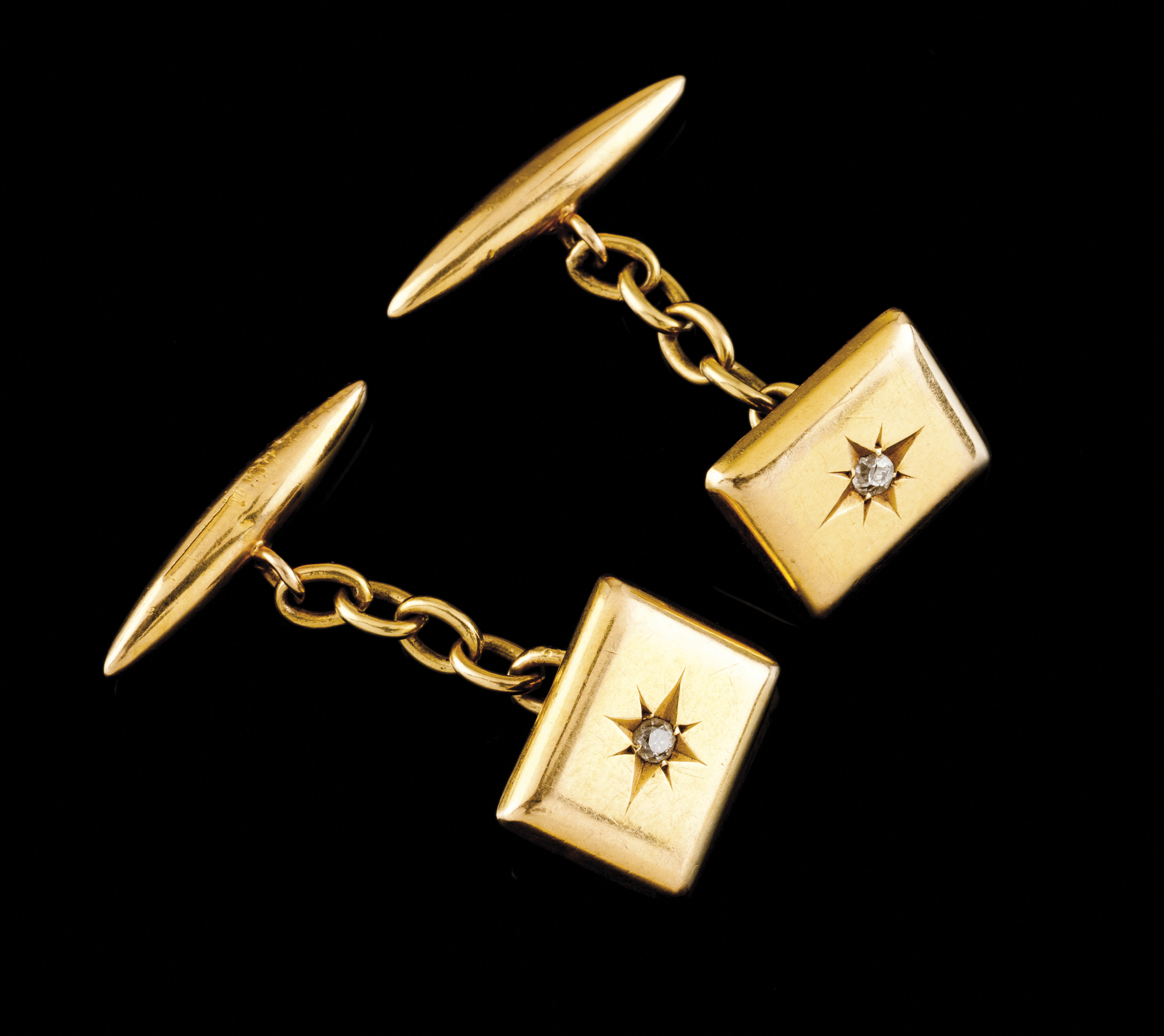 A pair of cufflinksPortuguese goldPlain rectangular shaped set in star with two antique cut