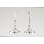 A pair of D. Maria candlesticksPortuguese silver, 18th centuryFluted shaft and foot on a circular