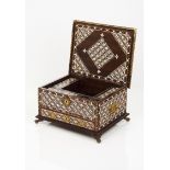 A writing casePart ebony coated teak of inlaid ivory and ebony geometric pattern decoration with