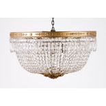 A chandelierGilt bronze structure with molded decorationGilt bronze and carved wood finialWith cut-