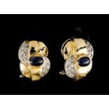 A pair if earringsBicoloured goldSet with small diamonds and two cabochon cut sapphires (ca.6x4mm)