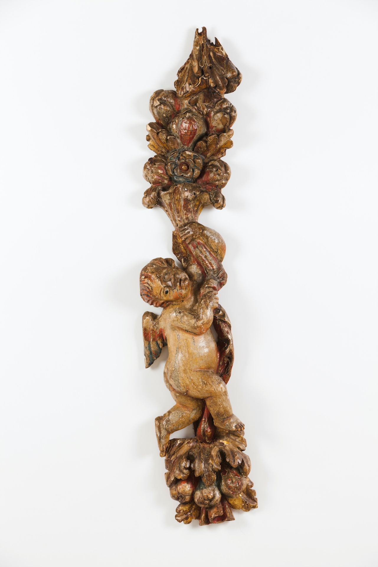 A pair of carved segmentsCarved and gilt woodPutti, flowers and fruit decorationPortugal, 18th