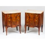 A pair of Louis XV/XVI style bedside cabinetsThornbush and mahogany marquetry decoration of
