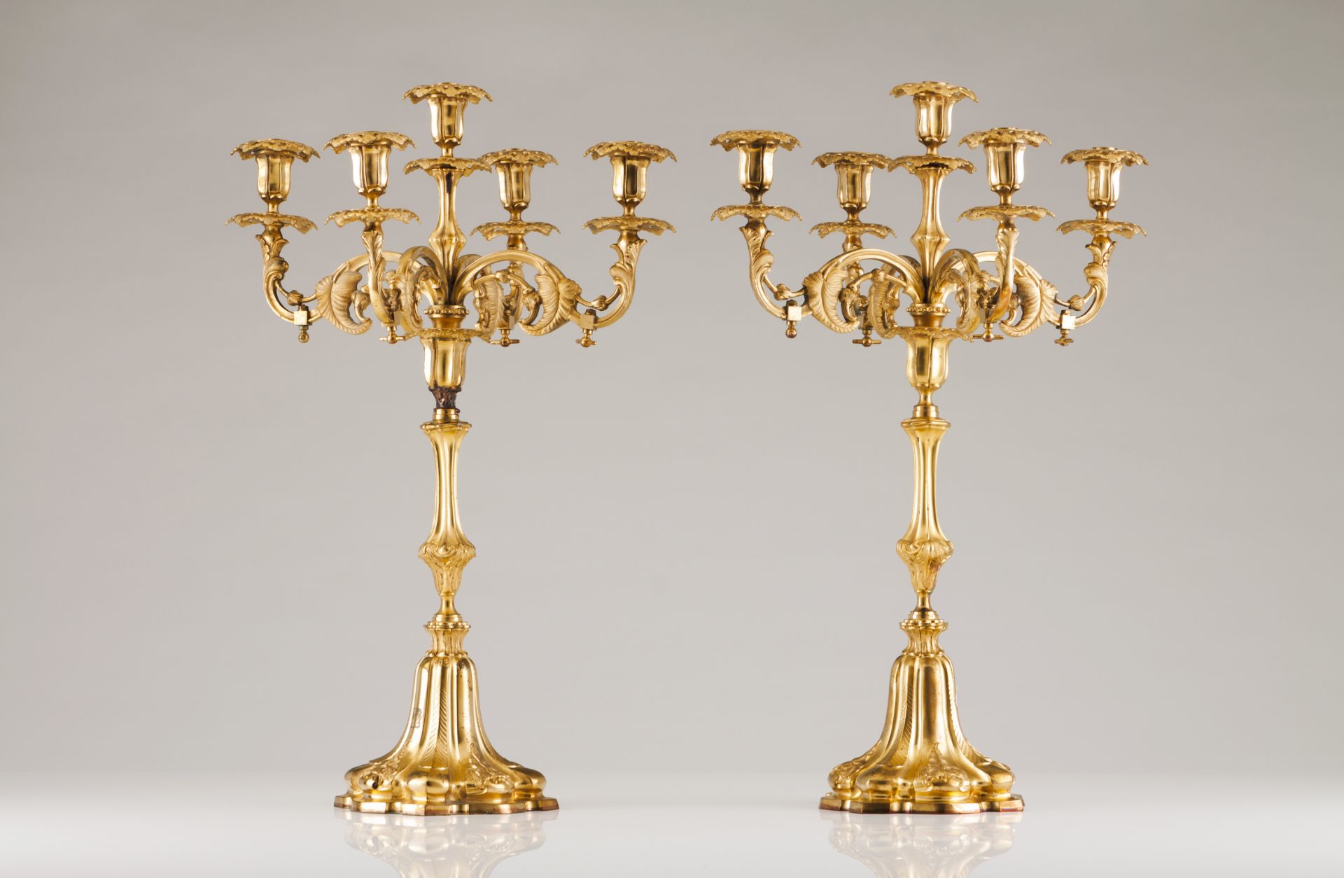 A pair of five branch Napoleon III candelabraGilt bronze(one with restoration)Height: 58 cm