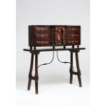 A cabinet on standWalnutSix drawers and central pigeonhole with satinwood and tortoiseshell inlaid